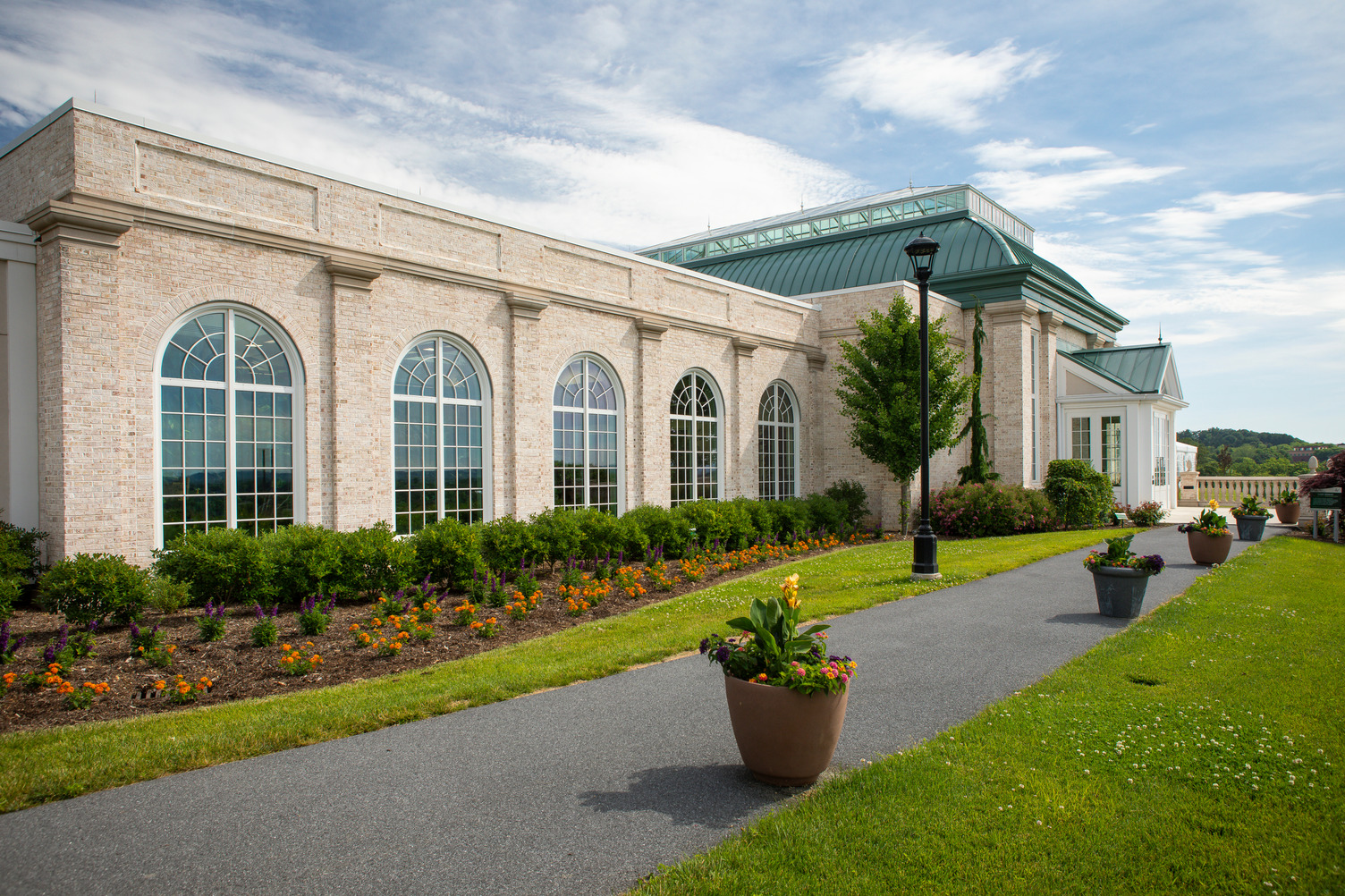 Full height Palladian-style windows with garden view